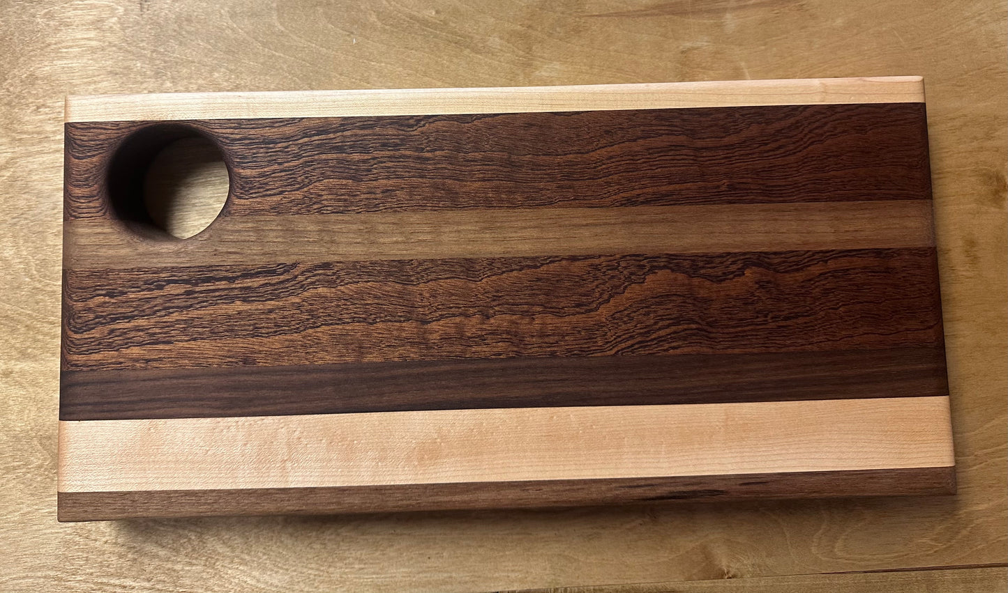 Hand-carved cutting board - walnut, maple and sapele